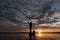 Silhouette of Fishermen throwing net fishing in sunset time at W