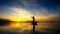 Silhouette of fishermen using nets to catch fish at the lake