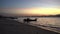 Silhouette fishing boat at beach