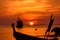 silhouette fishing boat at sunset
