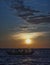 silhouette of a fishing boat at sunset on the ocean