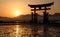 Silhouette of floating Torii Gate at sunset, Miyajima island, Hi