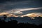 Silhouette forest and palm tree against dramatic color rainbow sky nature phenomena beautiful cloudscape