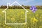 Silhouette frame of a house, meadow with flowers