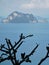 Silhouette of frangipani against an island off Thailand