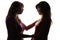 The silhouette of friendly relations between mother and daughter teenager, mother gives advice with love