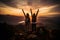 Silhouette of friends cheering on top of mountain