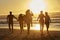 Silhouette Of Friends Having Fun Running Along Winter Beach