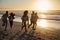 Silhouette Of Friends Having Fun Running Along Winter Beach