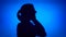 Silhouette of frustrated woman cry. Female`s face in profile scream in despair on blue background