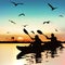 Silhouette of funny girls kayaking.