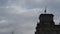 Silhouette of German flag waving on tower of Deutscher Bundestag building at dusk. Close up of historic ornamental