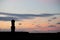 Silhouette of a giant statue of Easter Island at sunset. The moai of Ahu Ko Te Riku, Hanga Roa, Easter Island, Chile