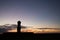 Silhouette of a giant statue of Easter Island at sunset. The moai of Ahu Ko Te Riku, Hanga Roa, Easter Island, Chile