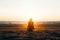 Silhouette of a girl on the beach at sunset