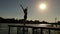 Silhouette of girl doing yoga at a beautiful lake.