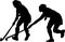 Silhouette of girl hockey players battling for possession