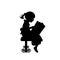 Silhouette of girl reading books