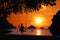 Silhouette of a girl sitting on a swing or cradle on the beach at sunset