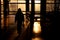 Silhouette of a girl walking alone through the hallway