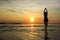 Silhouette Girl welcome sunrise on beach