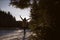 Silhouette of a girl in winter forest