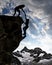 Silhouette of girls climbing on rock