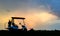 Silhouette golf cart in golf course with colorful twilight sky background