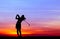 Silhouette golfer playing golf at beautiful sunset