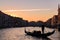 Silhouette of gondola on the Grand Canal at sunrise / sunset time, Venice