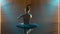 Silhouette of a graceful ballerina in a chic image of a black swan. Dancing of elements classical ballet. Shot in a dark