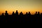 silhouette of group of friends standing