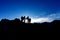 silhouette of group of hikers walking through the rocky volcanic landscape in the Volcan Poas National Park in the Alajuela
