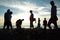 Silhouette of group of people at top of mountain