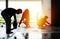 Silhouette group of workers build the cement floor in the house under construction