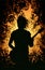 Silhouette of a guitarist performing in a crowd of fans. AI generated.