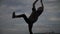 Silhouette of a guy doing a somersault