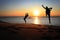 Silhouette of gymnast on beach at sunset