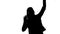 Silhouette of happy dancing woman with open palms