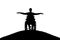 Silhouette of happy disabled man in wheelchair on top of hill