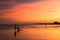 Silhouette happy family enjoy sunset at dusk on beach