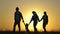 Silhouette of happy family, walking hand in hand, walks in field at sunset. children hold hands of mom and dad. happy