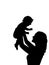 Silhouette happy mother holding newborn baby in air closeup