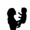 Silhouette happy mother holding newborn baby closeup