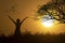 Silhouette happy woman open arm and bigtree with birds