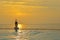 Silhouette healthy lifestyle woman practicing yoga and exercising relax vital meditate on swimming pool and the beach at sunset.