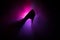 Silhouette of a high heel women shoes at dark. Women power or women domination concept