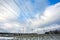 Silhouette of the high voltage electric pylon towers on the background of beautiful clouds