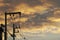 Silhouette of High Voltage Electrical Poles with Cloudy Sky at Twilight