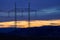 Silhouette of High Voltage Electricity Tower in the cuntryside during the sunset.